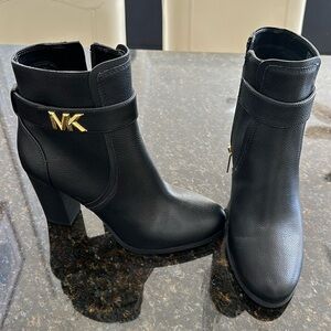 Michael Kors Black booties with Gold hardware. Like new, Never been worn.